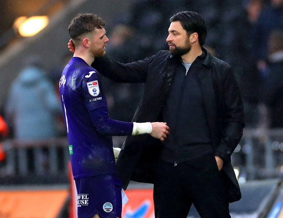 Swansea City manager Russell Martin (right) speaks to goalkeeper Andy Fisher at the end of the Sky Bet Championship match